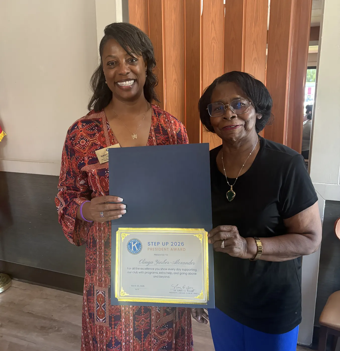Olinga receiving a Kiwanis award